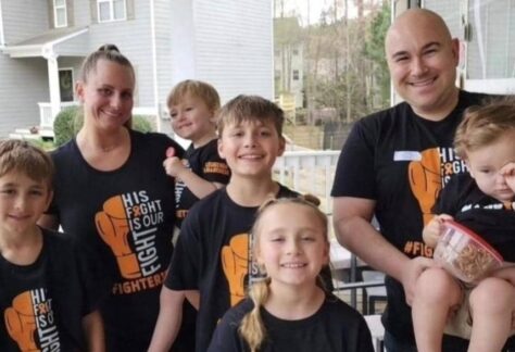 Jon Sharkey with his wife and children wearing fighter jet shirts in support of Jett’s leukemia battle