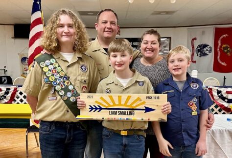 Helping One Guy Honors Jon Smalling with his wife Ashlyn and sons at a family scouting event